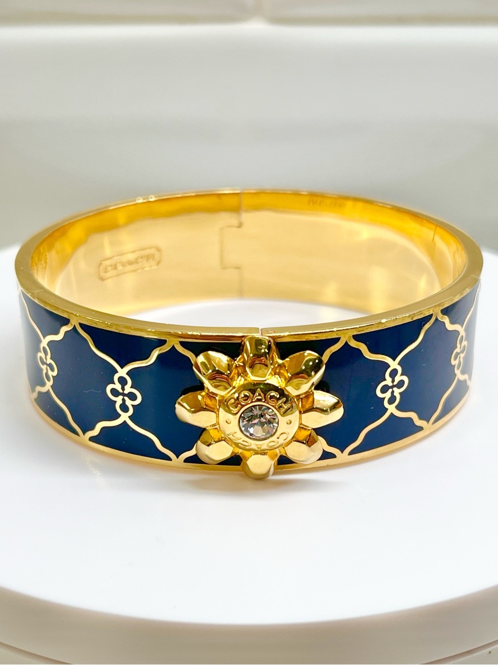 Coach Goldtone Hinged Bangle with Floral Medallion EUC